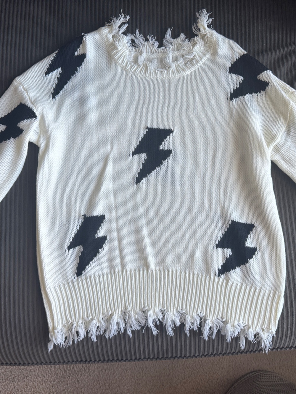 Ivory Fringe Crewneck Sweater with Black Lightning Motif